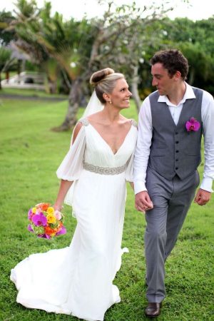 Pronovias 2011 Famosa. Grecian inspired gown featuring draped sleves and accented with a beaded belt and shoulders.