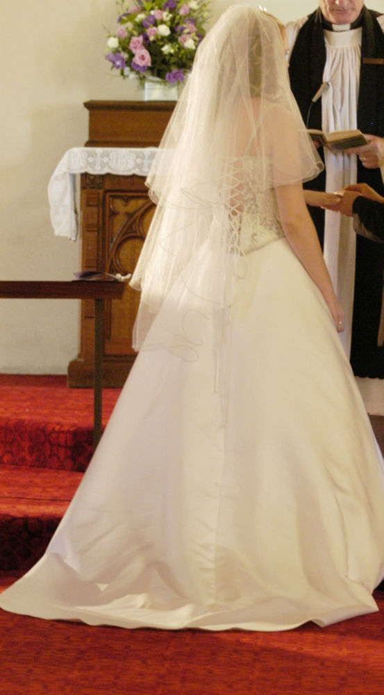 Silver edged white medium lengthed veil. Worn once. As new!