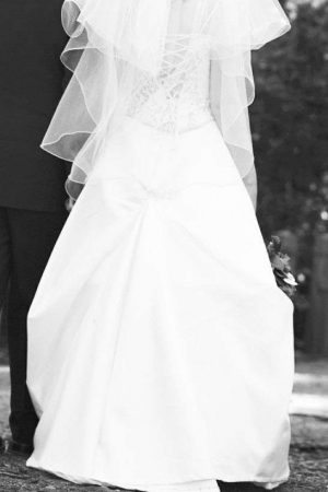 Silver edged white medium lengthed veil. Worn once. As new!