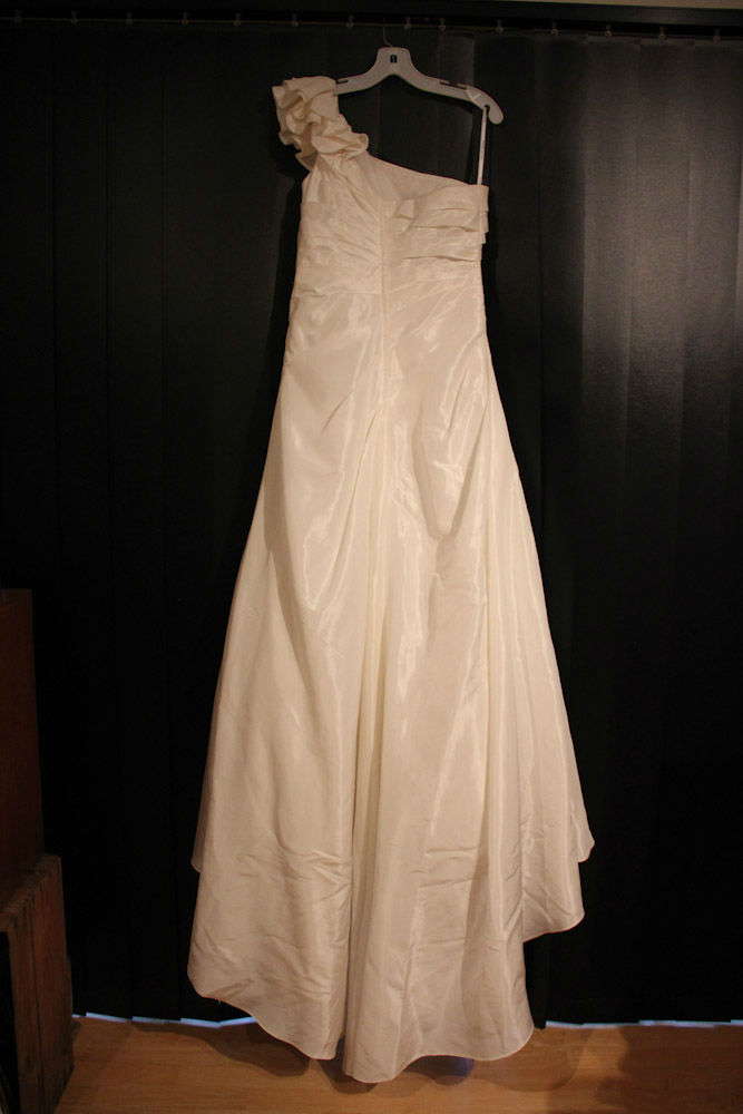 Figure flattering one shoulder A Line ivory gown bought in the US