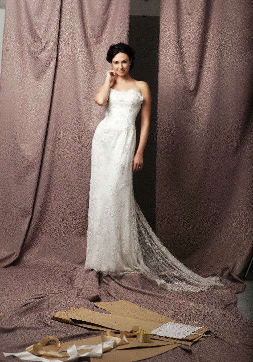 Delicate slim line lace gown with 3D petals across the bust & sheer lace train