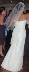the dress bustled and short veil
