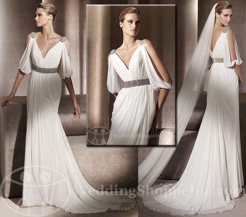 Pronovias 2011 Famosa. Grecian inspired gown featuring draped sleves and accented with a beaded belt and shoulders.